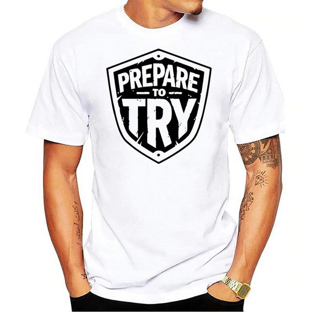 Mens white T-Shirt, black graphic text prepare to try in a armor shield shape